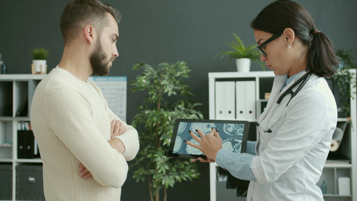 A physician reviewing results with a patient
